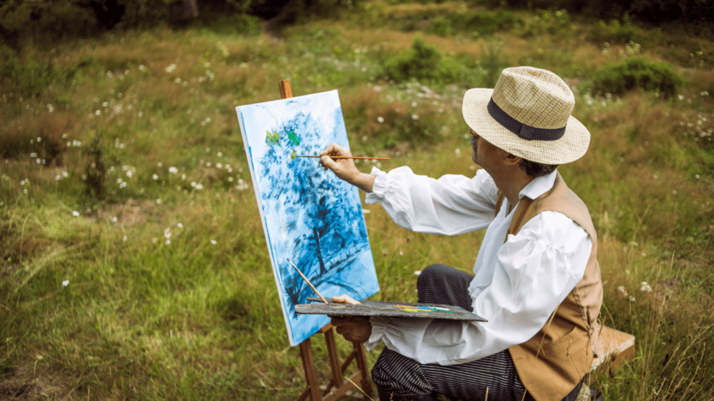 a person paints a landscape