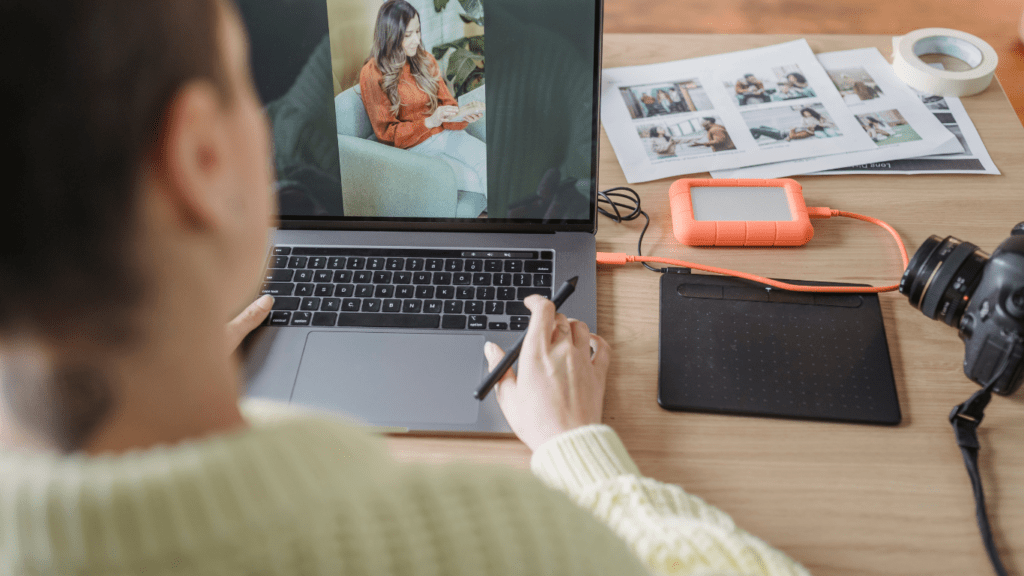 A person sitting at a desk with a computer on it