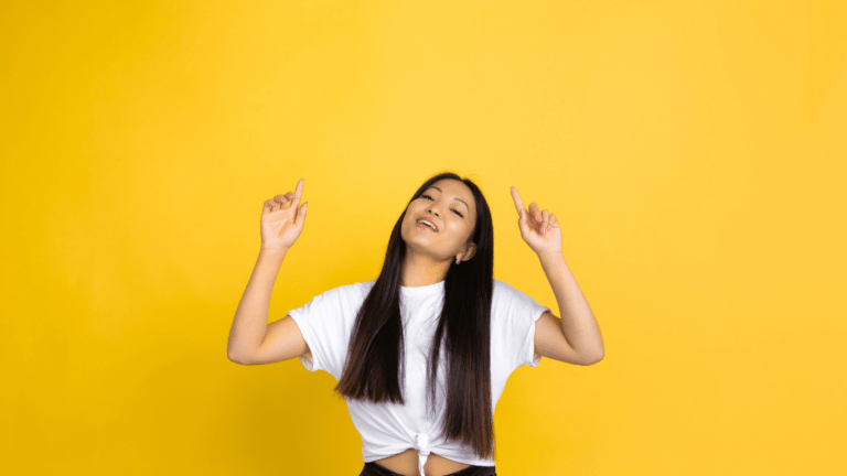 woman standing in yellow background