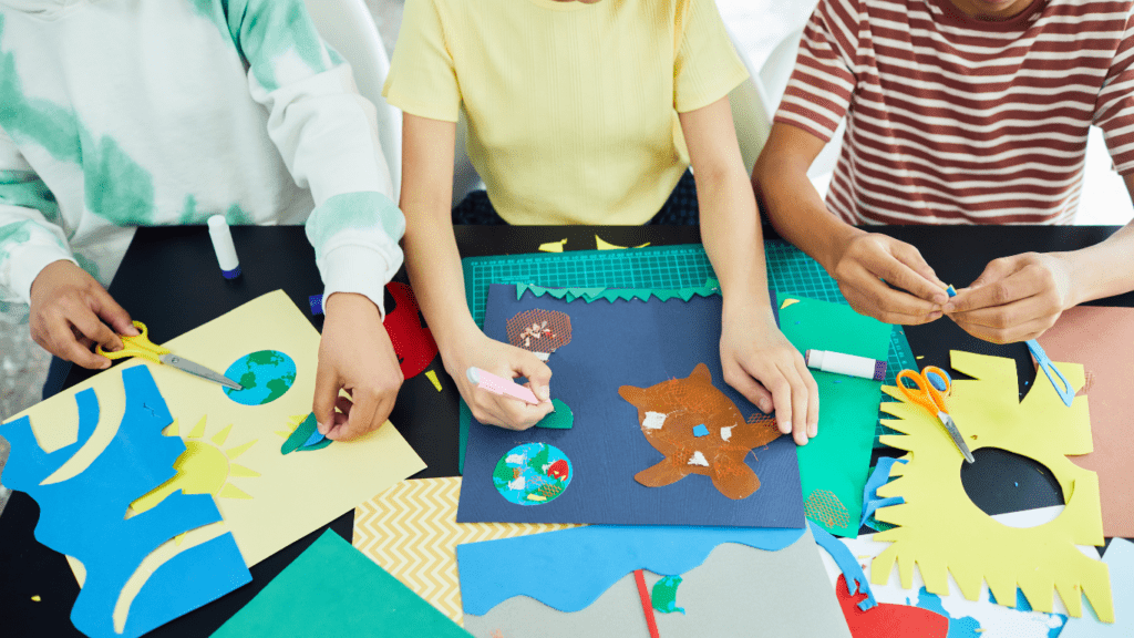 a group of people working on paper crafts