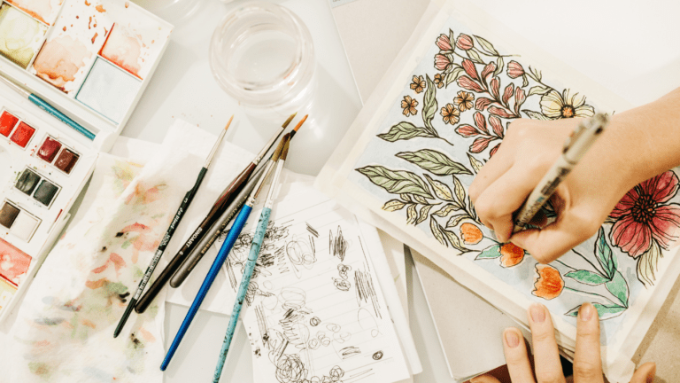 woman making a painting artwork on her table