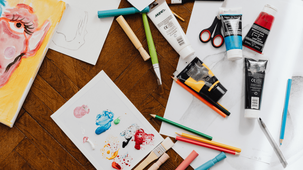 an assortment of art supplies on a table