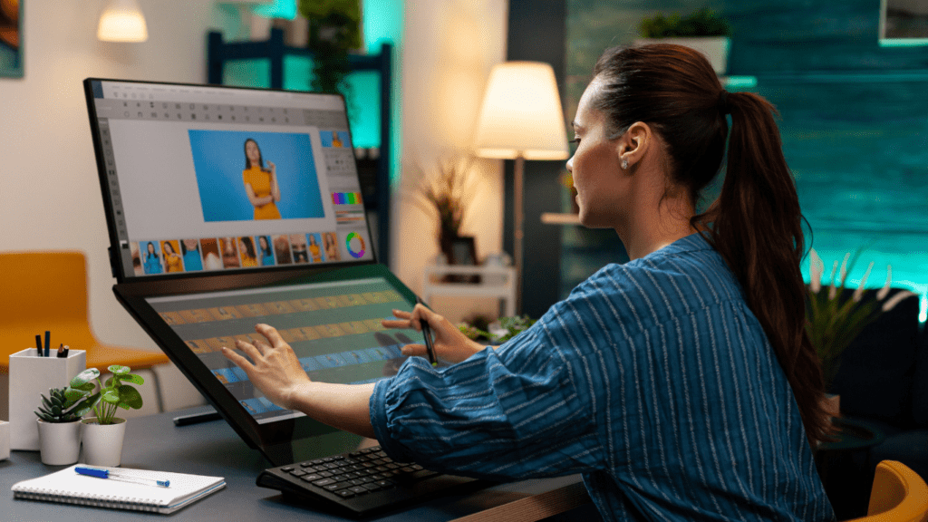 A person sitting at a desk with a computer on it