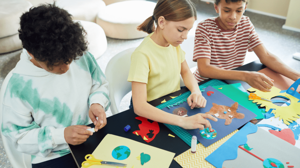 a group of people working on paper crafts