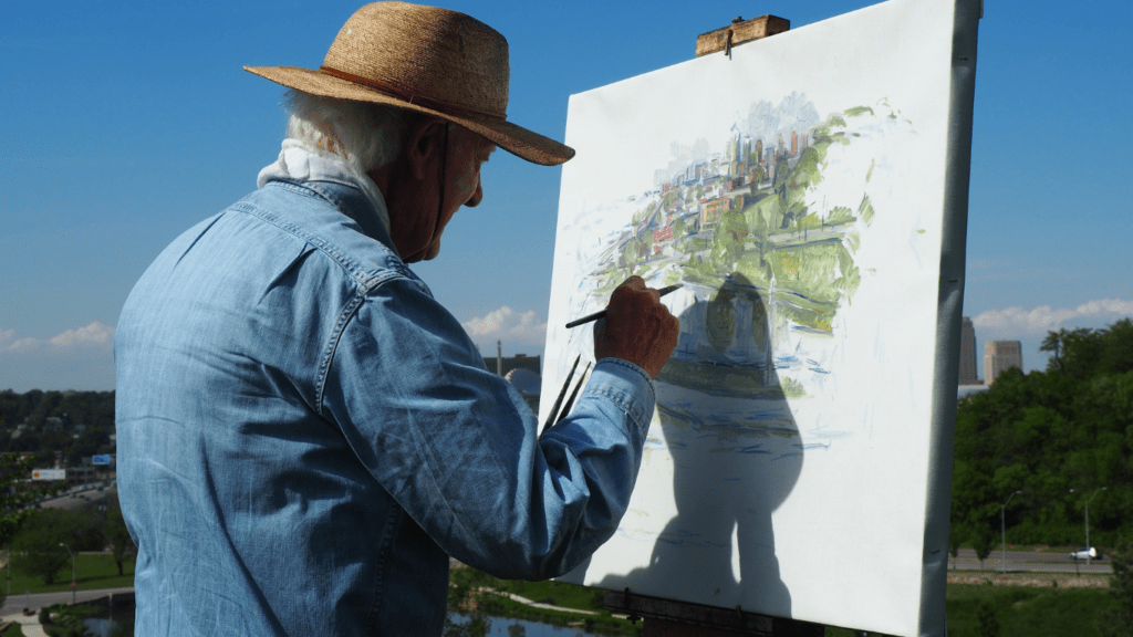 a person paints a landscape 