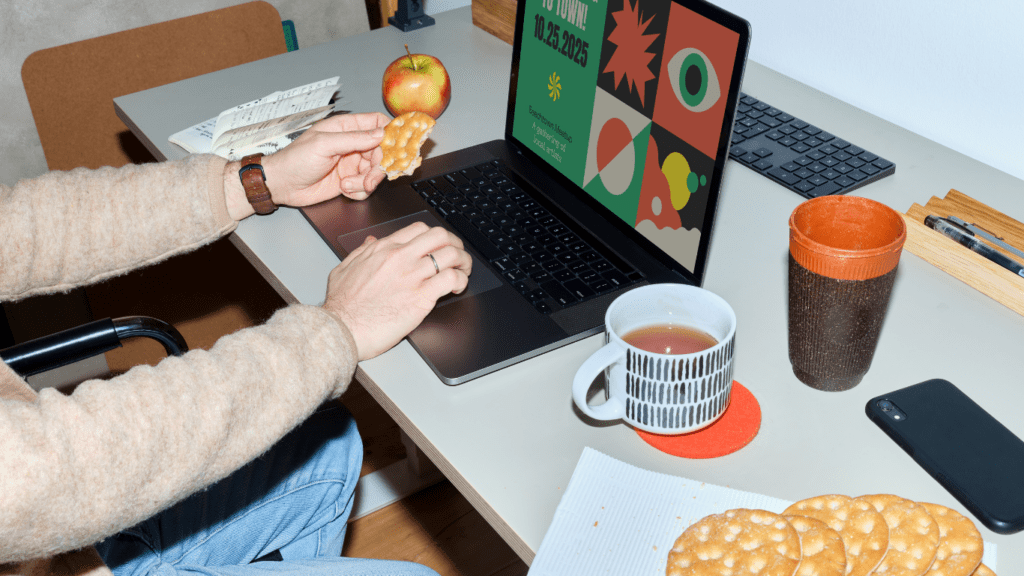 a person sitting at a desk in front of a computer screen