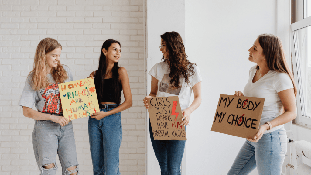 people holding up signs